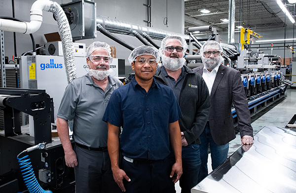 Jones Healthcare Staff in front of HEIDELBERG Galllus Labelmaster Printer